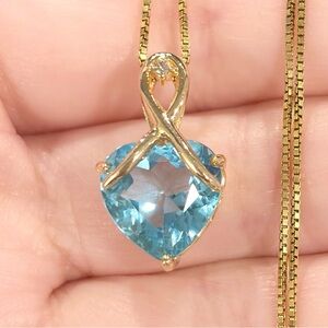 14K Gold Swiss Blue Topaz Heart Pendant: Diamond Accent Filigree